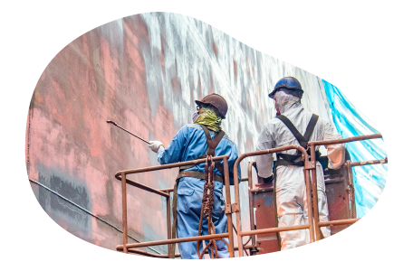 Sandblasting contractors working on a building.