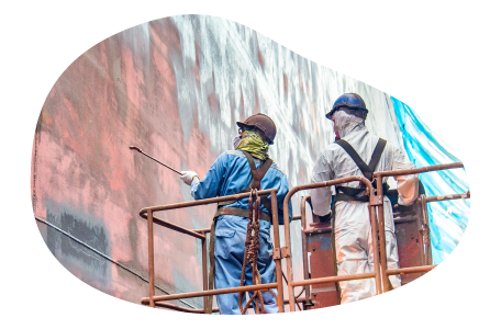 Sandblasting contractors working on a building. Sandblasting contractors working on a building.