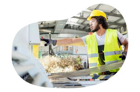 Sheet metal contractor cutting a piece of metal.
