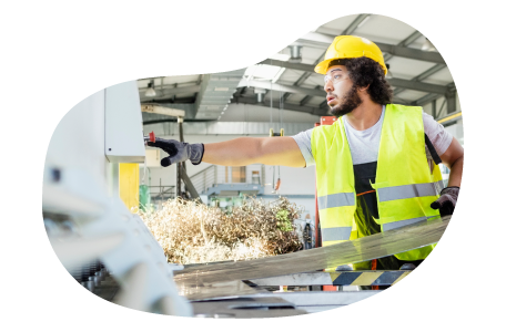 Sheet metal contractor cutting a piece of metal. Sheet metal contractor cutting a piece of metal.