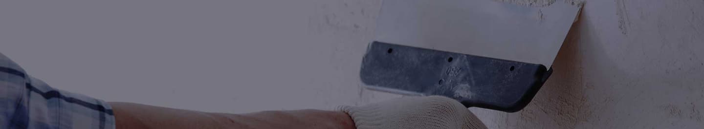 Hand plastering a wall