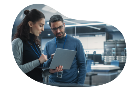 Research consultant going through company data with a client. Research consultant going through company data with a client.