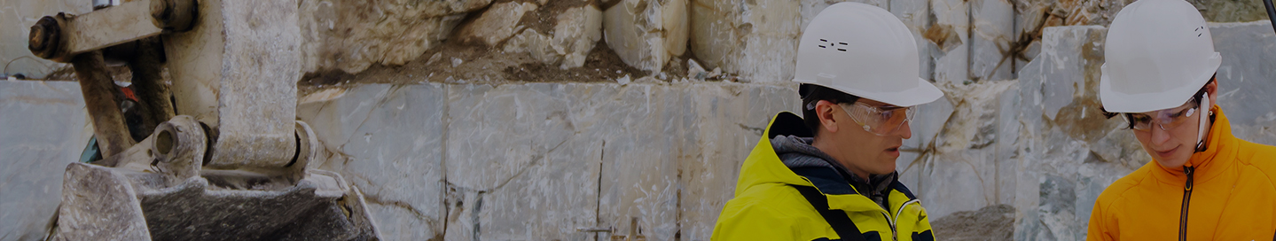 Contractors discuss a project at a construction site.