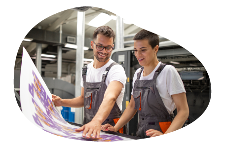 Print shop employees creating a giant photo. Print shop employees creating a giant photo.