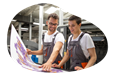 Print shop employees creating a giant photo.