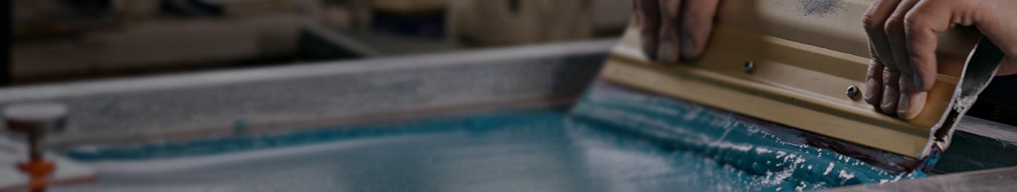 Screen printer with blue ink. Screen printer with blue ink.
