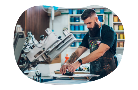 Screen printing professional setting up a station. Screen printing professional setting up a station.
