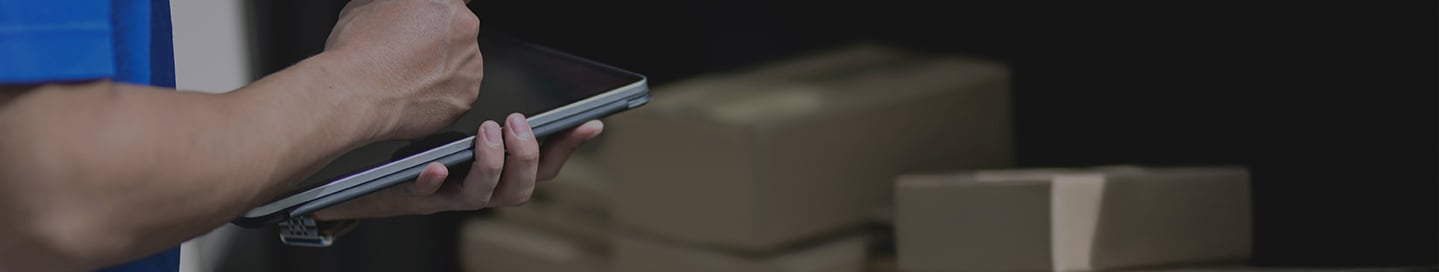 An Amazon Flex driver verifies a shipment of packages. An Amazon Flex driver verifies a shipment of packages.