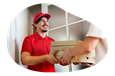 A delivery driver hands several boxes of pizza to a customer.