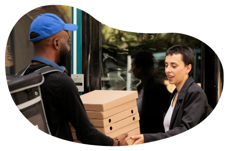 An Uber Eats driver delivers pizza to a customer.