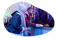 A couple buys tickets at an amusement park.