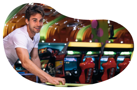 A customer plays air hockey in an arcade. A customer plays air hockey in an arcade.