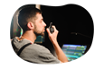 An audio-visual (AV) technician works at a production console.