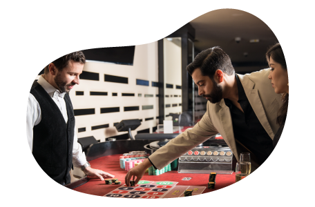 Players bet on a roulette wheel at a casino.