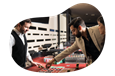 Players bet on a roulette wheel at a casino.