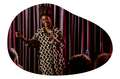 A stand-up comedian performs at a comedy club.