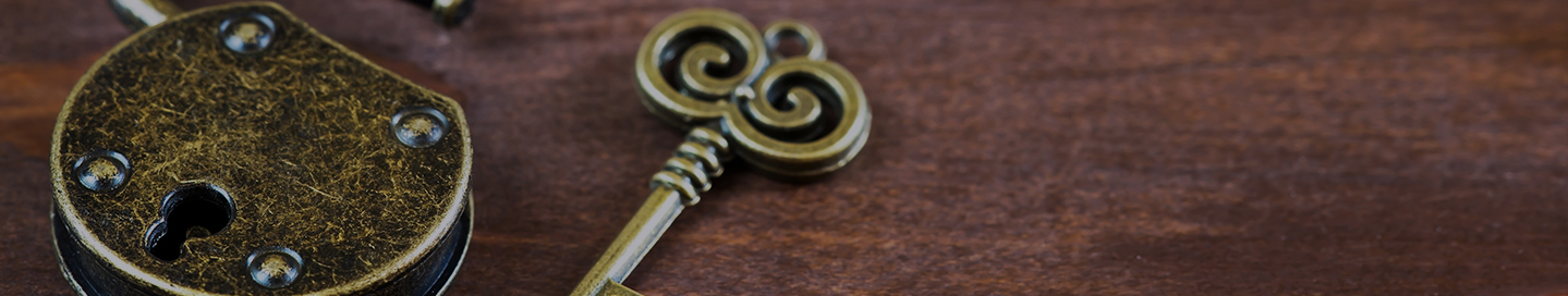 An old fashioned key and padlock in an escape room.