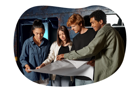 Customers work together to solve a puzzle in an escape room.