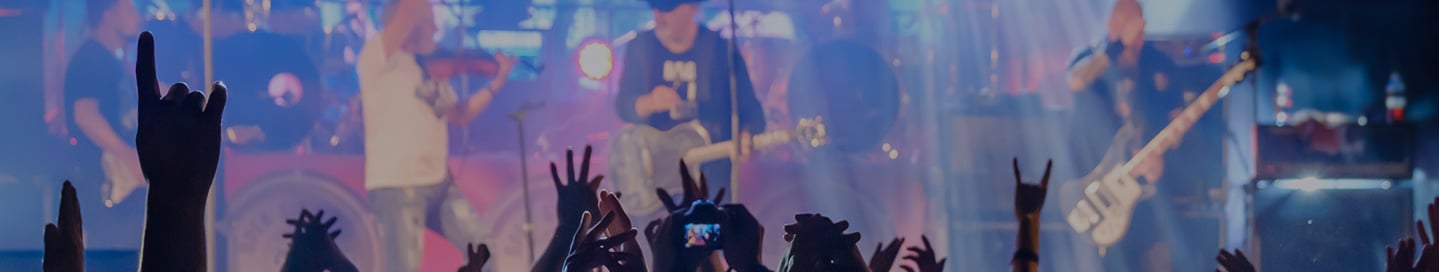 A crowd before the stage at a rock concert. A crowd before the stage at a rock concert.