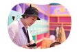 An employee at an indoor playground supervises children.