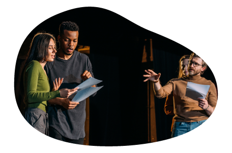 Actors rehearse a theatrical production on a stage. Actors rehearse a theatrical production on a stage.