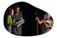 Actors rehearse a theatrical production on a stage.