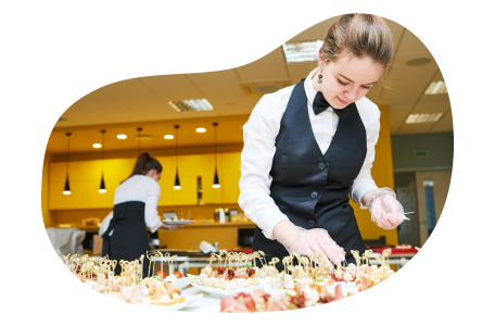 Caterer organizing appetizers on a tray.