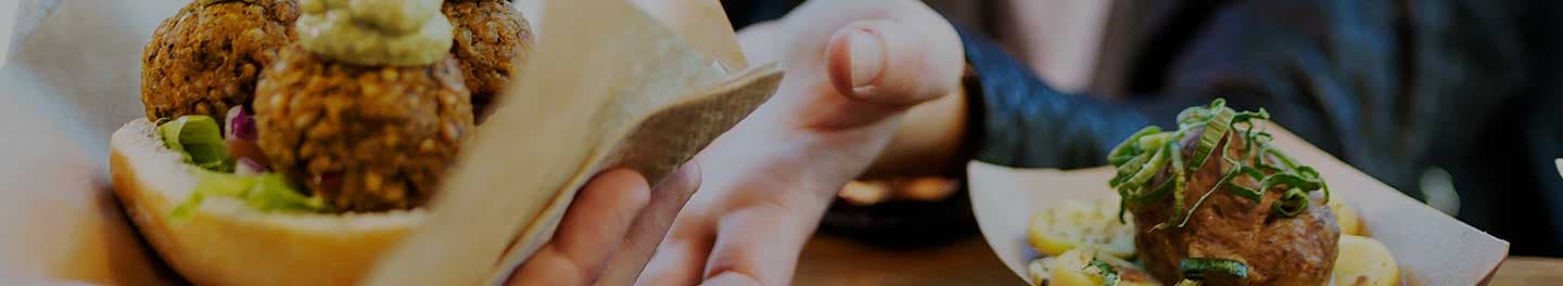 Food truck owner serving food.