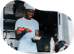 Food truck cook putting together an order.