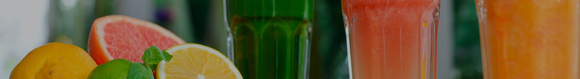 Citrus fruit and glasses of juice.