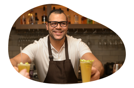 A mobile bartender hands drinks to customers.