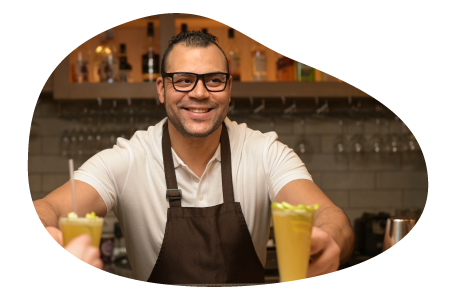 A mobile bartender hands drinks to customers. A mobile bartender hands drinks to customers.