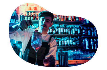 Bartender mixing a drink in a night club.