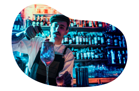 Bartender mixing a drink in a night club. Bartender mixing a drink in a night club.