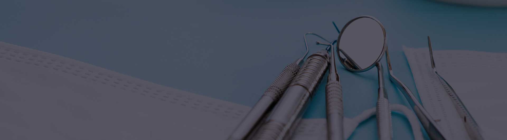 Dental tools laying on a table. Dental tools laying on a table.