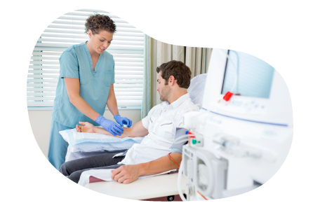 Dialysis center medical professional preparing a patient. Dialysis center medical professional preparing a patient.