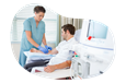 Dialysis center medical professional preparing a patient.