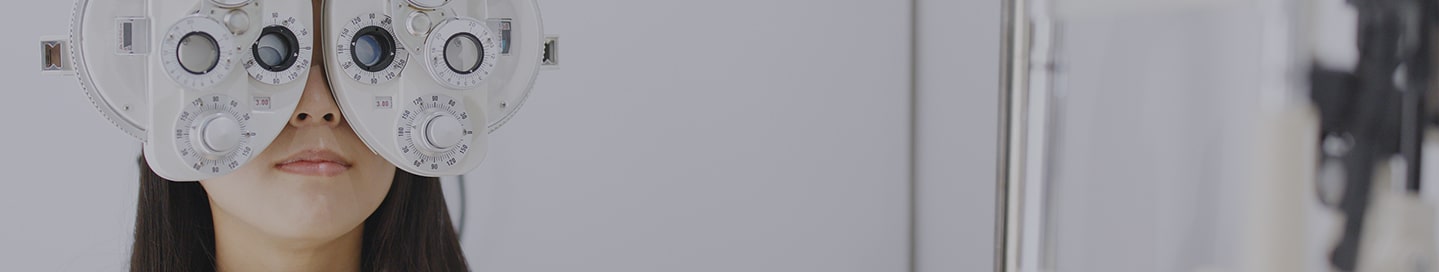 Woman receiving eye examination at office