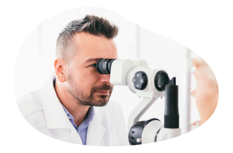 Doctor examining equipment in a laser eye center. Doctor examining equipment in a laser eye center.