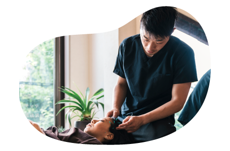 Acupuncturist treating a patient.