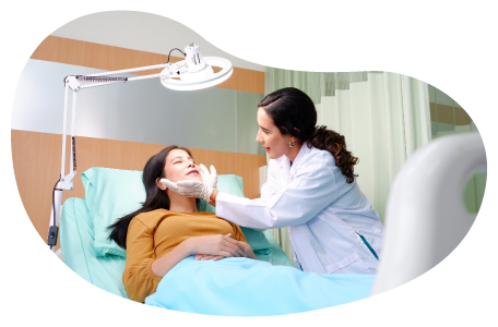 An aesthetic nurse examines a patient's face. An aesthetic nurse examines a patient's face.