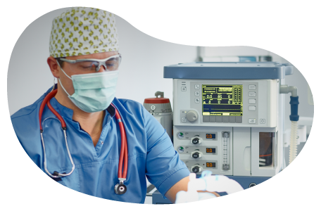 An anesthesiologist monitors a patient.