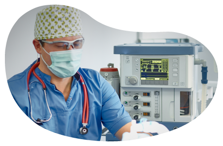 An anesthesiologist monitors a patient. An anesthesiologist monitors a patient.