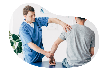 Chiropractor examining a patient's arm.