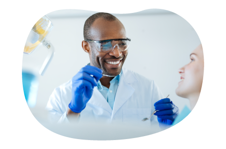 Dentist preparing to examine a patient.