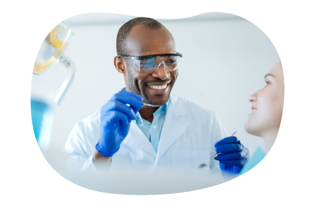 Dentist preparing to examine a patient. Dentist preparing to examine a patient.