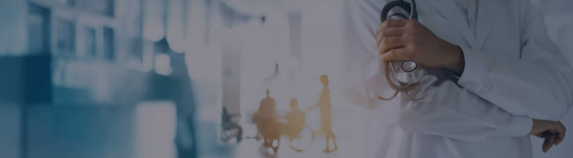 Doctor with a stethoscope in hand and hospital patients in the background.
