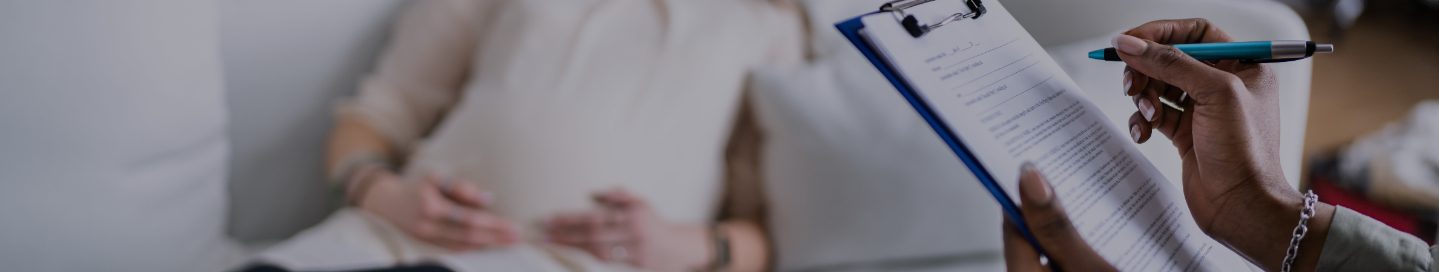 A doula looks at a checklist with a client.