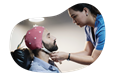 EEG technician preparing a patient for examination.