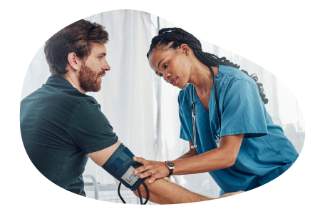 A medical assistant takes a patient's blood pressure.